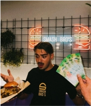 A guy chosing hamburger over money!