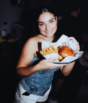 Girl enjoying her hamburger